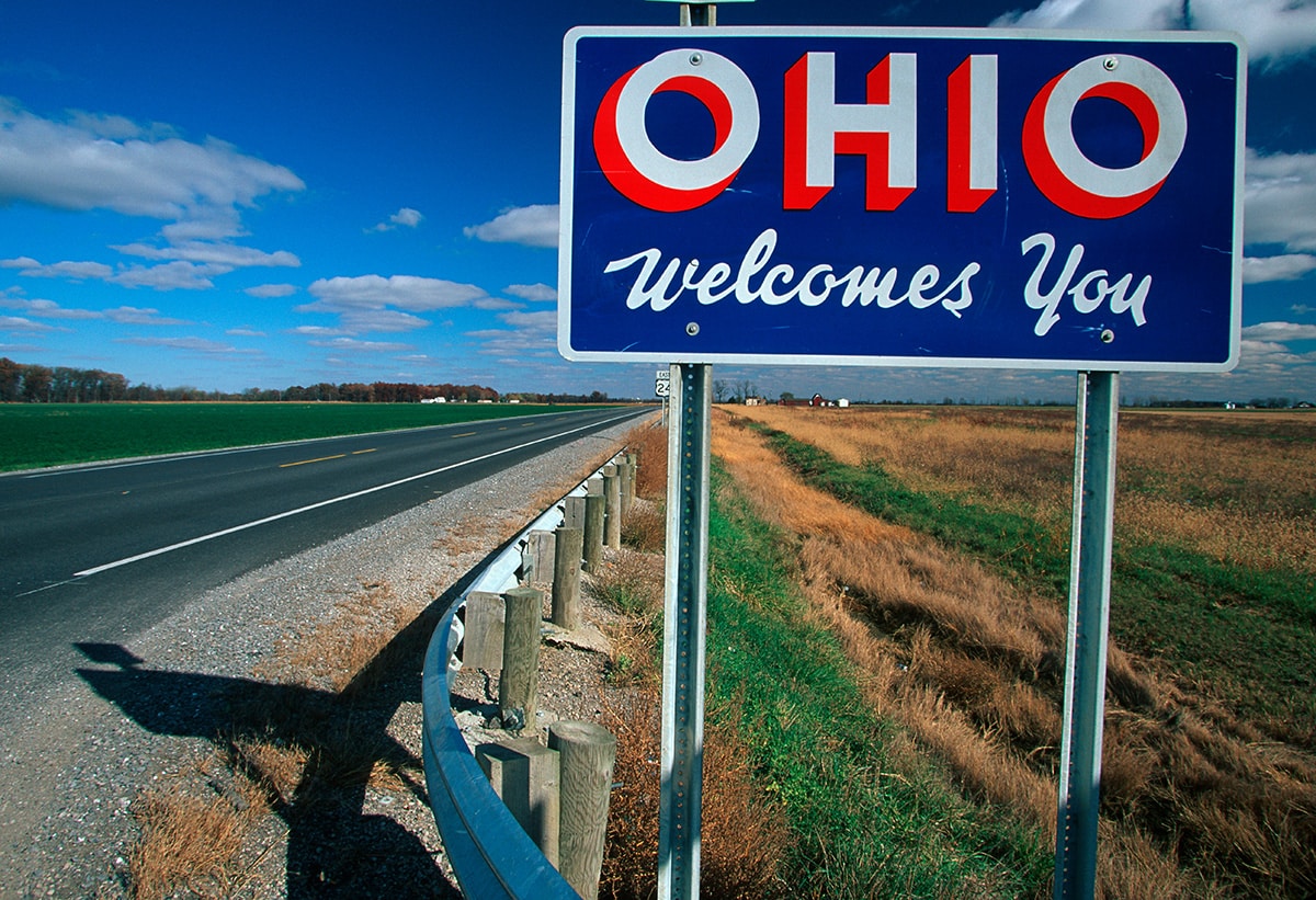 “Ohio Welcomes You Sign” on the side of the road.